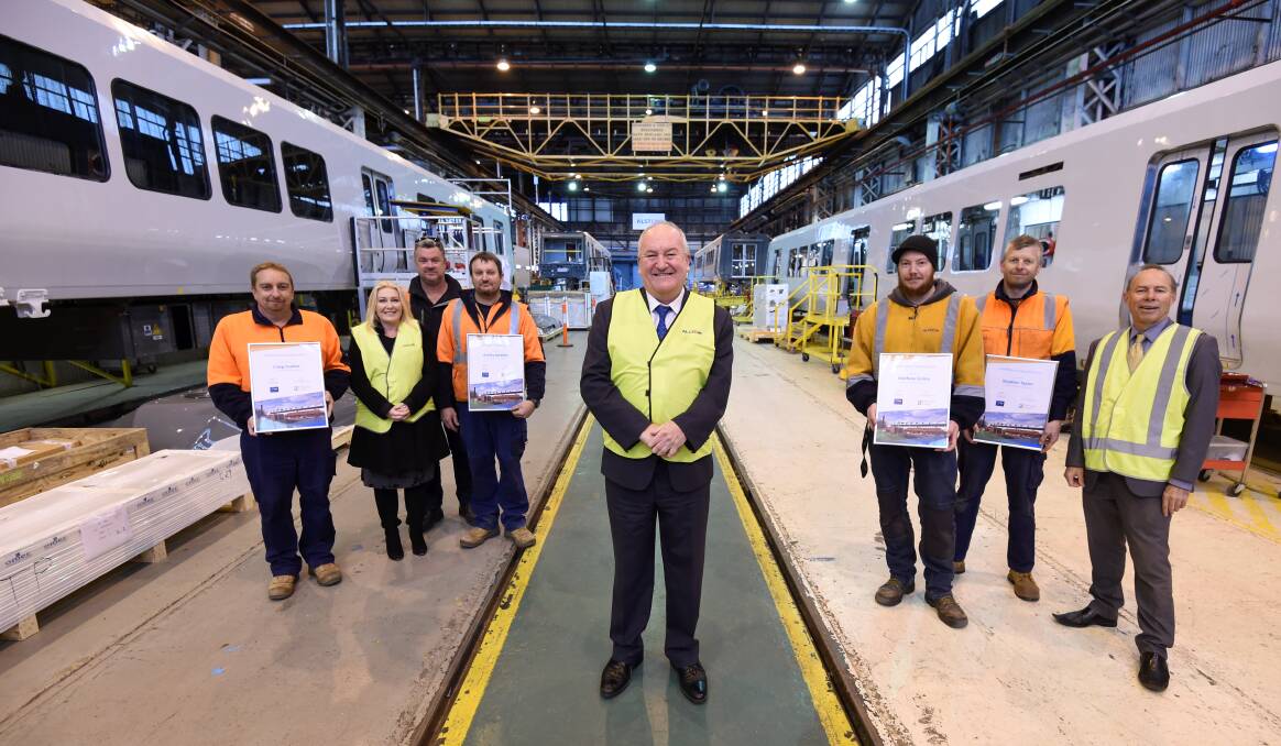 Skills on track: Minister for Training and Skills Steven Herbert (centre) with Alstom apprentice mentors Craig Coulter, Peter Douglas, Ashley Mabbitt, Steven Herbert, Mathew Grime, Steve Taylor and Ballarat MPs Sharon Knight (second from left) and Geoff Howard (far right). Picture: Lachlan Bence
