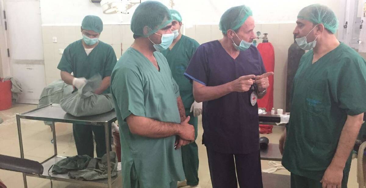 LIFE-SAVING: Dr Shorney with a surgical team in Afghanistan, where he says it is becoming increasingly complex and difficult for aid workers.