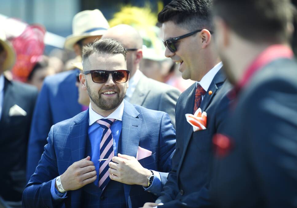 FASHION STAKES: Will Davies was among many fashion-goers from around the state who tried his luck at the Myer fashions on the field event. Picture: Luka Kauzlaric.