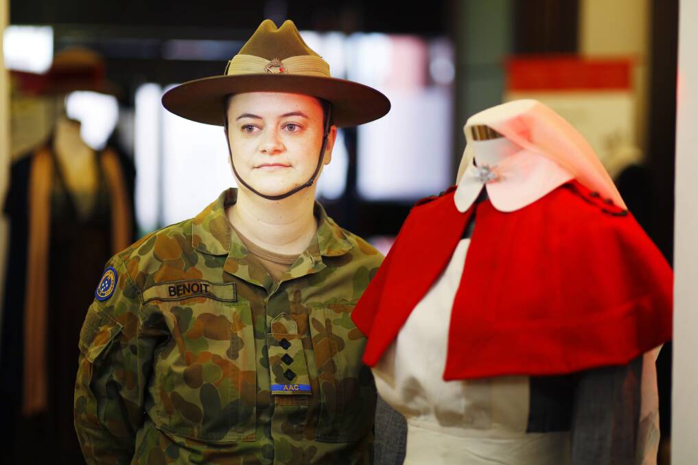 Captain (AAC) Margaret Benoit with an original WWI nurse uniform at the Women of Empire exhibition in Ballarat. Picture: Luka Kauzlaric.