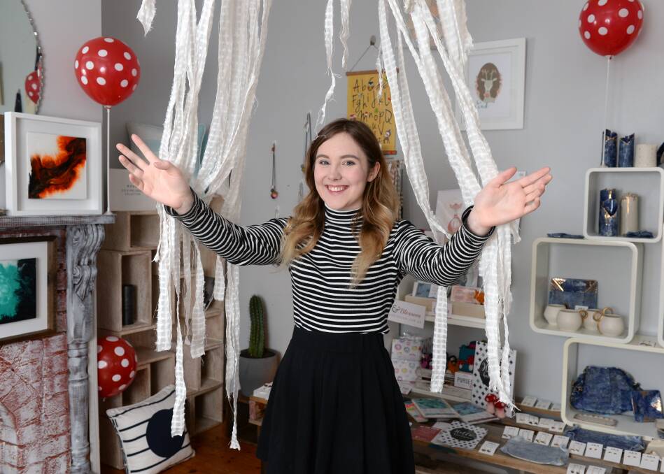 NEW SHOPPING INITIATIVE: Victoria Street's new pop-up shop manager Abbey Thompson opens the doors for the first time. Picture: Kate Healy.