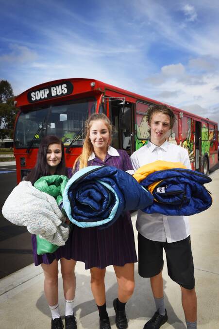 FUNDRAISE: Maddison Pearse, Sophie Norris and Quinn Rowland and other Phoenix P-12 students raised money for Ballarat's homeless youth. Picture: Luka Kauzlaric.