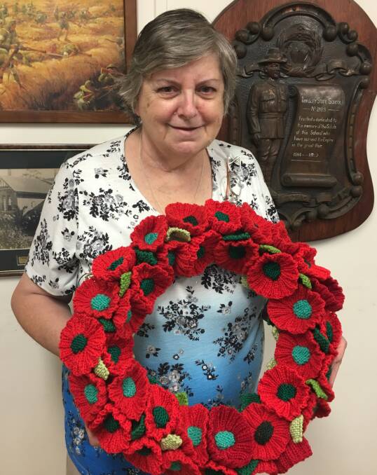 THOUSANDS OF POPPIES: June Webb from the Bacchus Marsh RSL Ladies Auxiliary made this wreath to be laid as part of ANZAC centenary commemorations next year. 