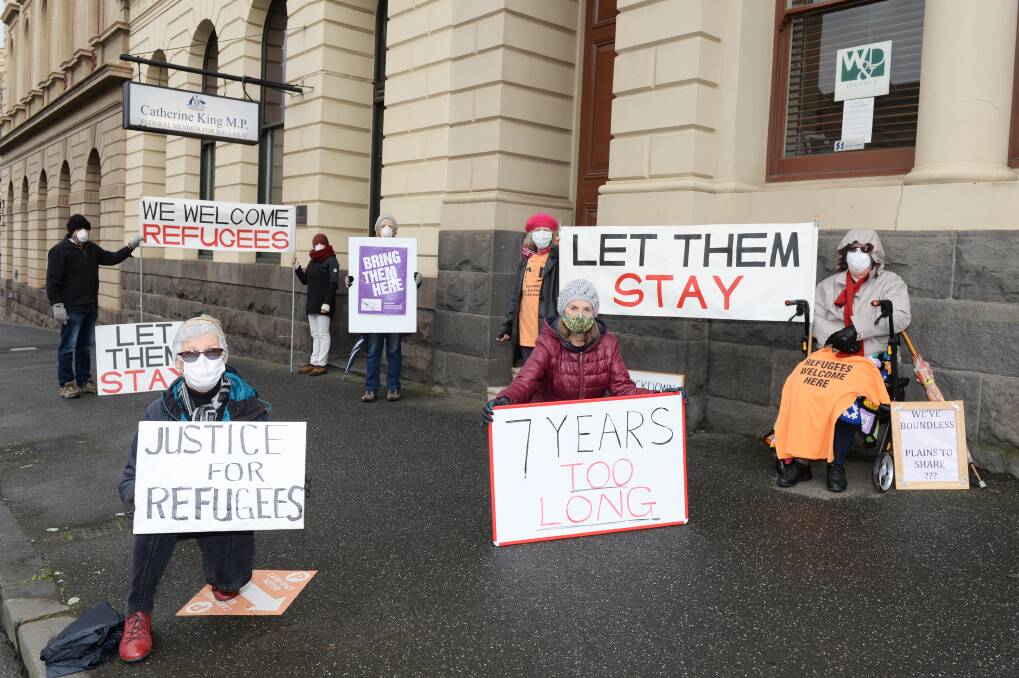 SPEAKING OUT: From back: Rick Elepans, Barbara Wagner, Dianne Reynolds, Wendy Bolger, Johanna, Henrietta Camilleri and Doreen Roache protest against offshore detention for refugees. Picture: Kate Healy 