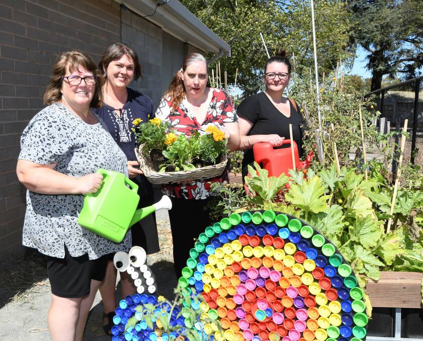 GARDEN LOVE: Volunteers Dianne Humphris, Lou Ridsdale, Sally-Anne McGeachin and Jane Bolte in the community garden. Picture: Lachlan Bence 
