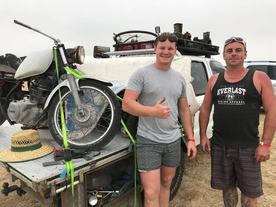 GOOD BUYS: Ryan Bauer and Charlie Horn tie down their purchases for the trip home to the Mornington Peninsula. 