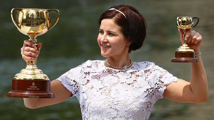 Michelle Payne with the Melbourne Cup on Wednesday, a day after she made history by being the first female jockey to win the race.   Photo: Scott Barbour