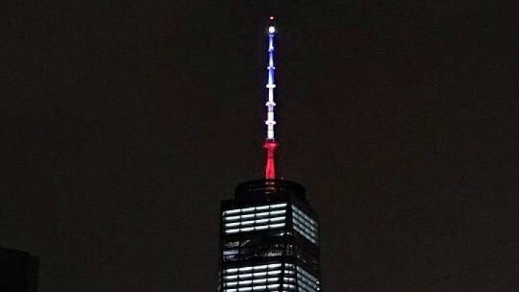 One World Trade Centre is illuminated in the colours of the French flag. Photo: Twitter / @Khanoisseur