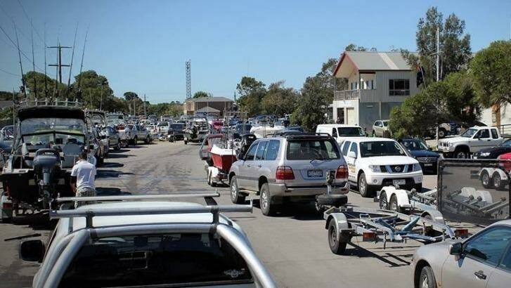 High and dry: Peak times at boat ramps at Carrum can mean queuing for hours.  Photo: Paul Carter