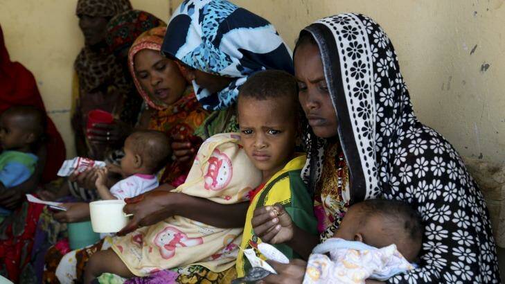 Mothers feed their children at a health post in Dubti, Ethiopia, earlier this month. Photo: Jay Court
