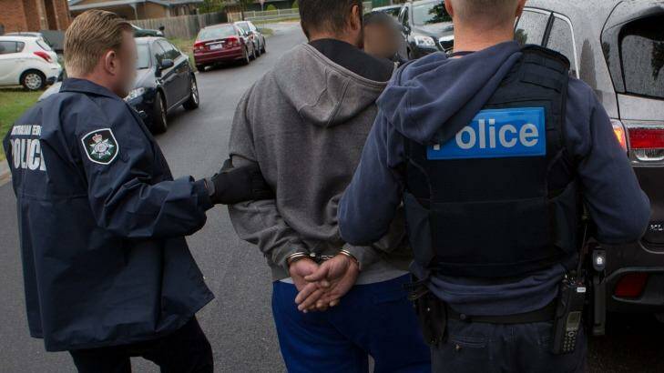 Police arrest a man in Melbourne on Wednesday in relation to the alleged cocaine importation and distribution operation. Photo: Australian Federal Police