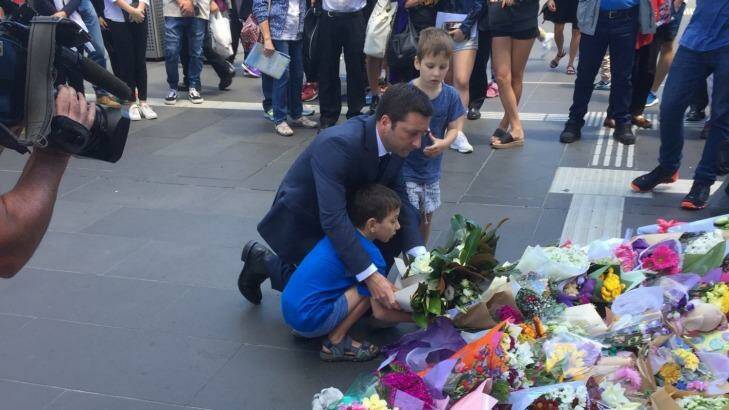 Opposition leader Matthew Guy pays his respects at the makeshift shrine in Bourke Street Mall. Photo: Neelima Choahan