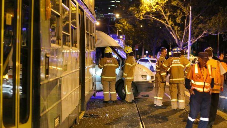 Emergency services at the scene of a collision between a tram and a van on St Kilda Road on Saturday night. Photo: Patrick Herve