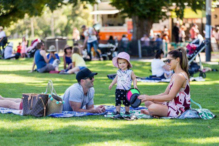 Matt, Charlo 18 months & Steph 0407 121 626. Family friendly NYE event at Edinburgh Gardens, North Fitzroy featuring dog shows and awards, food trucks, and an outdoor cinema. North Fitzroy, Melbourne. December 31st 2017. Photo: Daniel Pockett