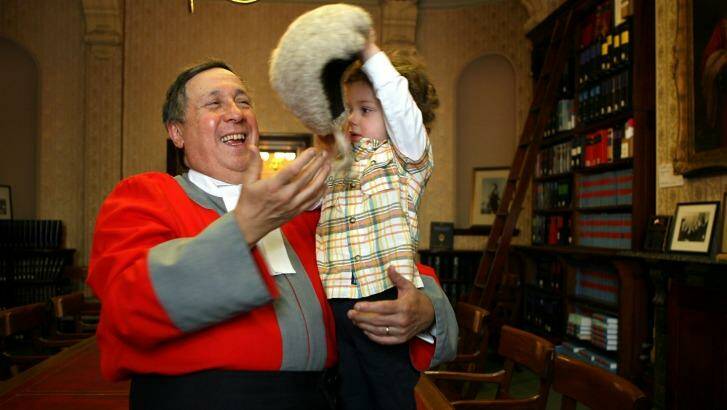 Supreme Court Justice Paul Coghlan with grandson Joseph. Photo: Joe Armao