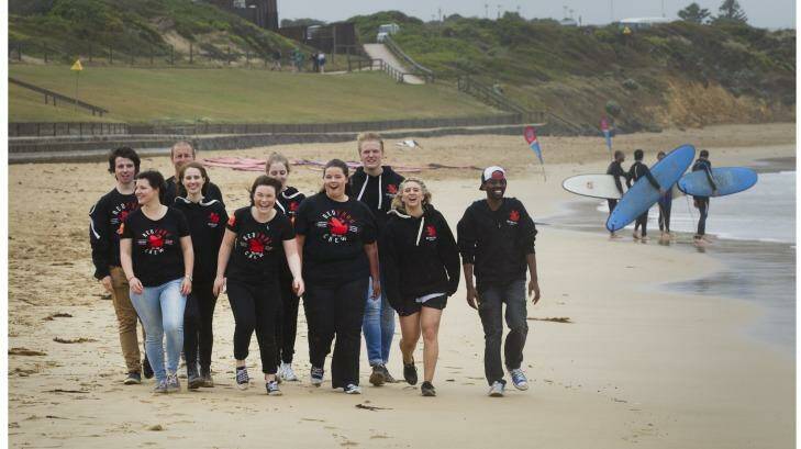 Brianna van't Hag (fifth from left), and her friends, pictured on the beach at Torquay, are among hundreds of young people volunteering as Red Frogs at Victorian schoolies which starts next week.  Photo: Simon O'Dwyer