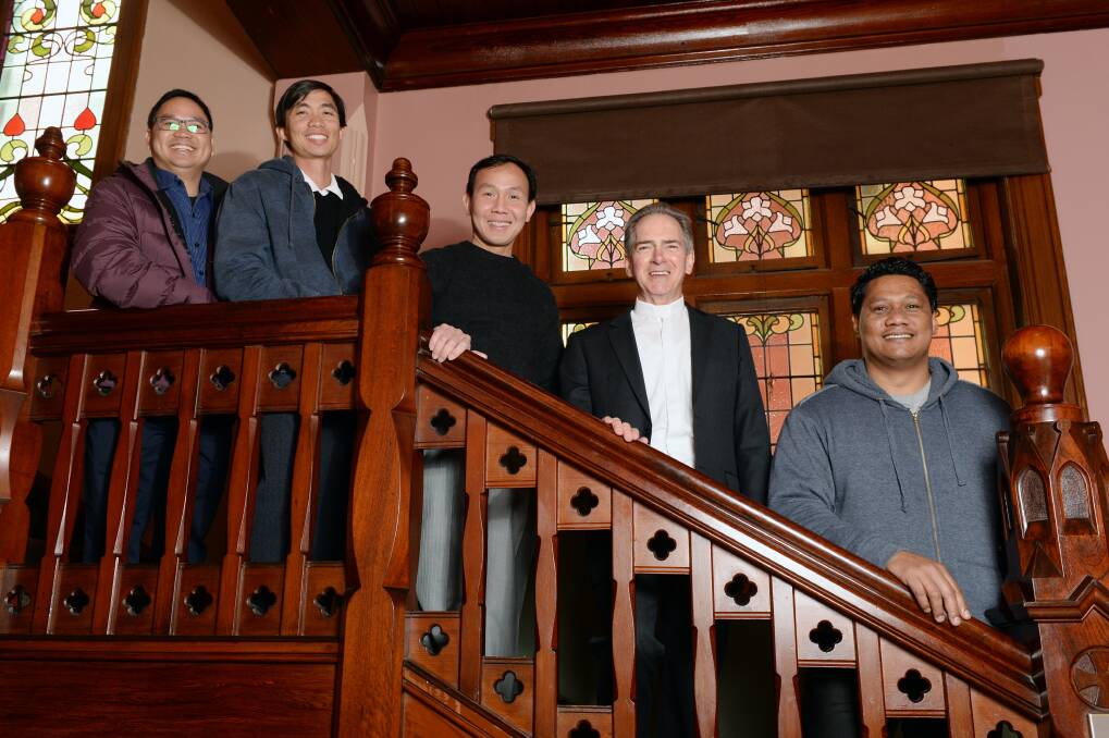 WELCOME: Newly ordained priests Anthony Tran Xuan Anh, Joseph Vu Ngol Tuyen, Peter Ly Trong Danh from Vietnam with Bishop of Ballarat Paul Bird and Samoan priest Felise Ielome. PICTURE: KATE HEALY