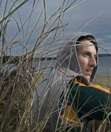 Island life: Ryan Lees on the beach at his home on Flinders Island. Photo: Michael Rayner