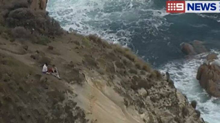 A couple have been left stranded on a cliff top after it began to crumble. Photo: 9 News Melbourne