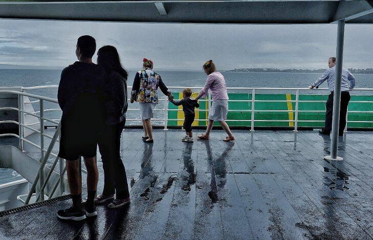 People travel aboard the Sorrento to queenscliff ferry on a rainy day on Saturday 13 January 2017. Photo Luis Enrique Ascui 