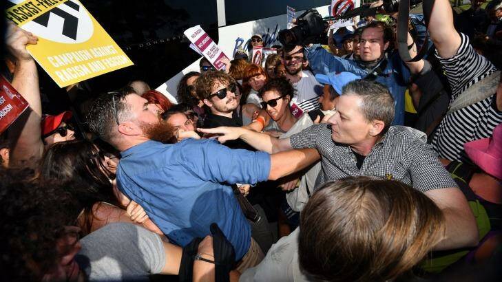 Anti-racist activists try to stop Q Society members boarding a bus at St Kilda Marina. Photo: Joe Armao, Fairfax Media.