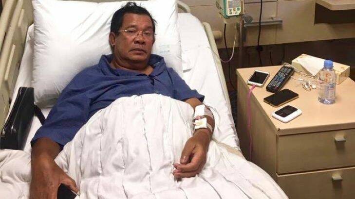 Hun Sen lies in a hospital bed in Singapore in May where he said he was treated for "extreme exhaustion." Facebook photo.