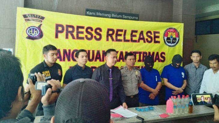 Two suspects paraded before the media after the capture of the alleged producer of bootleg liquor in Yogyakarta.
 Photo: Supplied