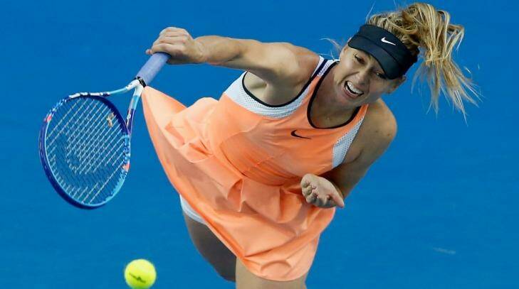 Maria Sharapova shows orange has more grunt on a blue court. Photo: Darrian Traynor
