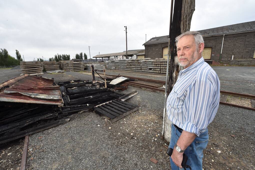 Concerned resident Gerald Jenzen surveys the remains of the burnt-out weighbridge at the Ballarat Railway yards 