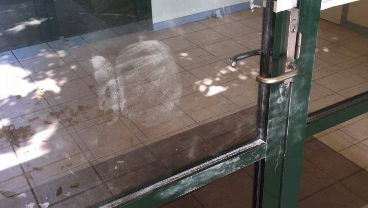 The bum print found on one of the entrance doors to the hall. Photo: Supplied