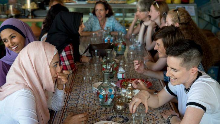 Aseel Tayah (left in pink) and Madelaine Imber (right) at the  Speed Date a Muslim event at the Moroccan Deli-Cacy in Lygon Street, East Brunswick.  Photo: Penny Stephens