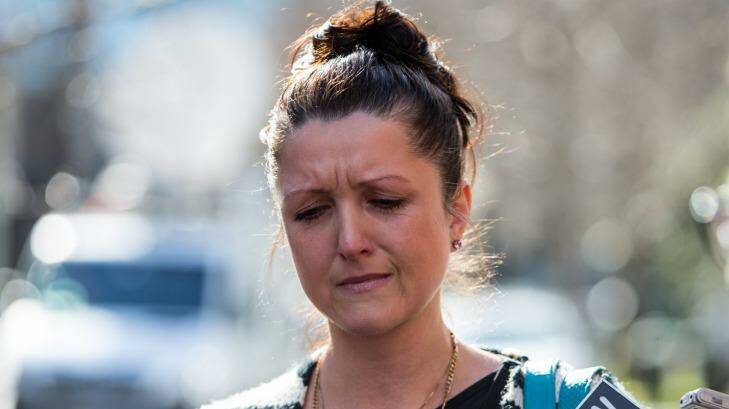 Nikki Komiazyk became emotional talking outside the court about the State Coroner's ruling on the death of her parents.  Photo: Jason South