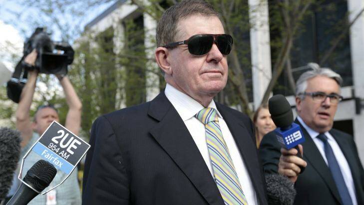 Former parliamentary speaker Peter Slipper leaves court after being sentenced to 300 hours community service last year. He was later cleared on appeal. Photo: Jeffrey Chan