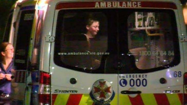 A boy is treated at the scene after a boat he was on sank while night fishing. Photo: Nine News