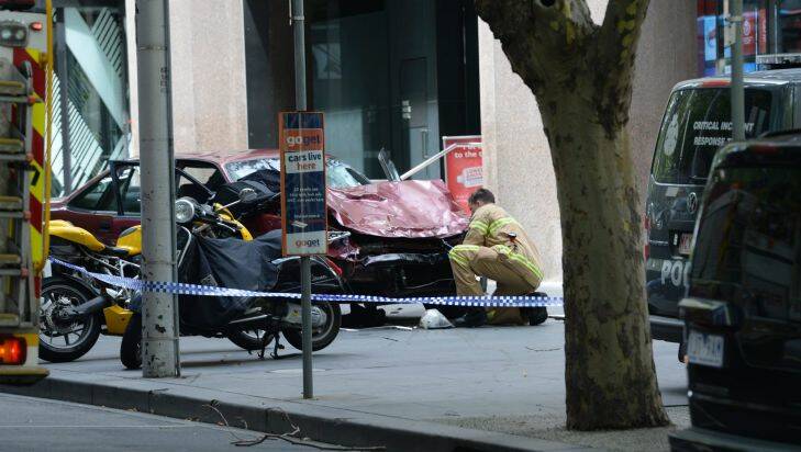 The Age 20/1/2017?? 
Police chase driver in Melbourne's CBD, pedestrians hit, reports shots fired in Bourke Street Mall.
Red car believed to be car police were chasing.?? 
Photo by Justin McManus?? 