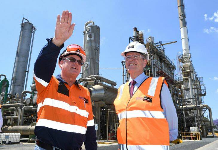 Federal Labor leader Bill Shorten (right) is seen with site manager Glen Poynter  during a visit to the Incitec Pivot industrial chemicals plant in  Brisbane,  Tuesday, October  10, 2017. Mr Shorten was in Brisbane to discuss the national energy crisis. (AAP Image/Dave Hunt) NO ARCHIVING