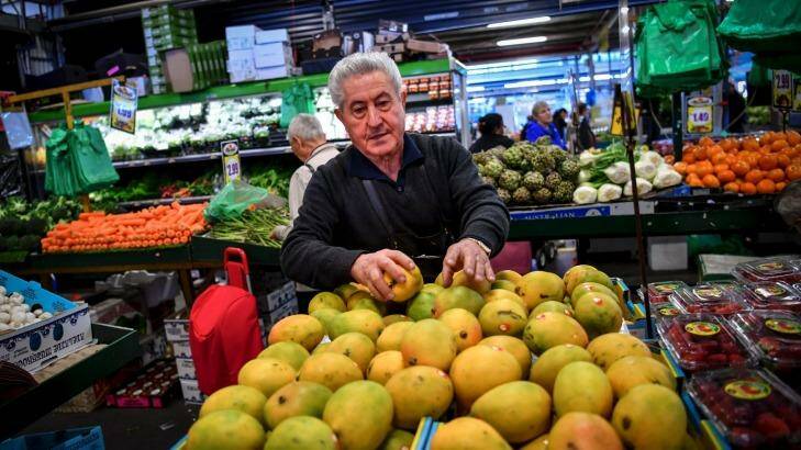 After a year off with throat cancer, Danny Luppino couldn't wait to get back to his Dandenong Market stall of 54 yers, where he feels he belongs.  Photo: Eddie Jim