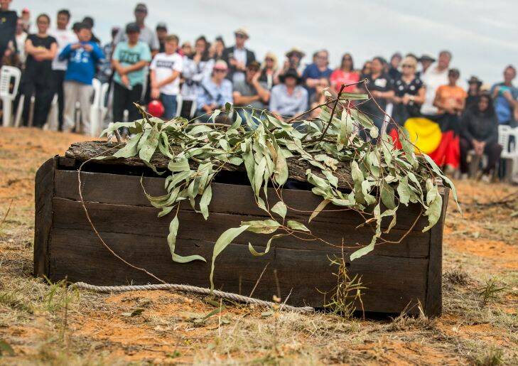 The Age, News, 17/11/2017, photo by Justin McManus.
Repatriation of Mungo Man's remains along with 104 other ancient ancestors back to conutry at Lake Mungo. The remains will be taken from thre National Museum of Australia's  storage faciclity in Canberra in the old Aboriginal hearse accompanied by elders from the Willandra region - the Mutthi Mutthi, Paakantyi?????? and Ngiyampaa?????? people. They will travel and be welcomed with ceremony from local elders at Wagga Wagga, Hay and Balralnald before being laid to rest at Lake Mungo.
 The 5000 year old redgum box containing Mungo mans remains back on country after a 40 fight to have them repatriated.