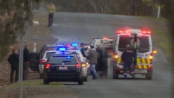 The Bendigo teen is helped into an ambulance after being found in Maiden Gully. Photo: Julian Fisher/Nine News