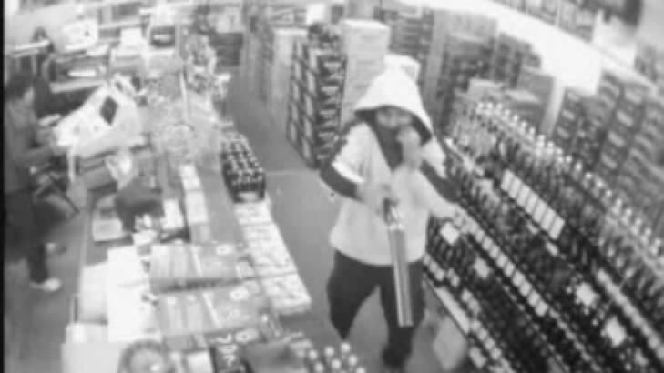 A CCTV image released by police of a hold-up of a Kingsville bottle shop in 2011.  Photo: Supplied