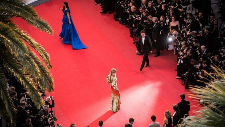 In the red: Sonam Kapoor and Natasha Poly attend the Cannes premiere The Sea Of Trees. Photo: Francois Durand