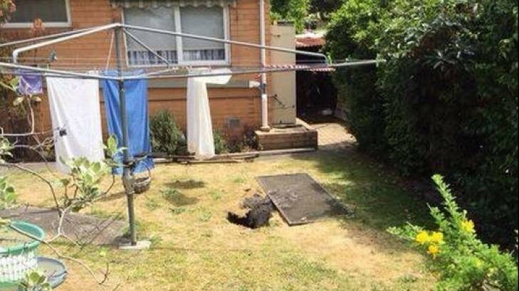 The sinkhole in the backyard of the Springvale South home. Photo: Nine News, via Twitter.