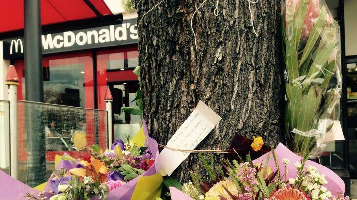 Flowers left at the scene of the attack on Joshua Hardy. Photo: Konrad Marshall