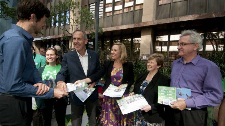 Bob Brown, Senator Larissa Waters, Christine Milne and candidate Andrew Bartlett pressed the flesh at a Brisbane pre-poll on Tuesday. Photo: Robert Shakespeare
