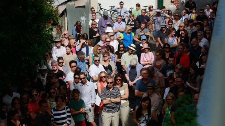 A crowd gathers for an auction. Photo: Chris Hopkins