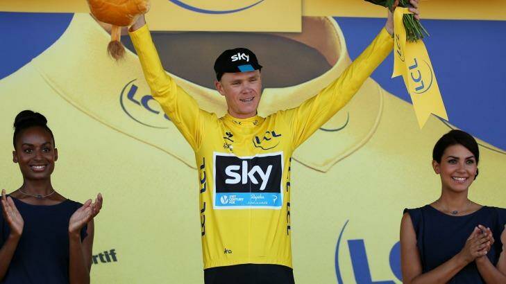 Chris Froome of Great Britain and Team Sky celebrates as he retains the yellow jersey following stage eight of the 2015 Tour de France. Photo: Doug Pensinger