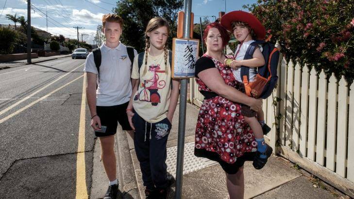 Single mother Allyson Griffith, who is calling for free public transport for schoolchildren, with her kids Charlie Gray, 14, Lucinda Gray, 12, and Felix Carrillo, 4, in Preston on Sunday. Photo: Luis Ascui