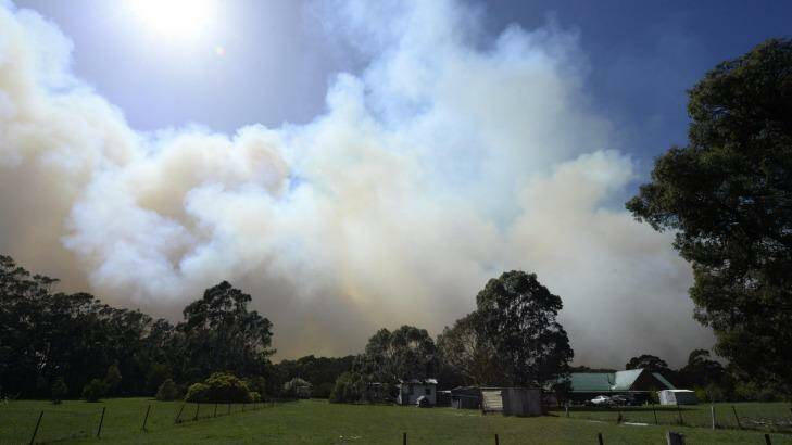 CFA firefighters protecting a property off Feeney's lane, Benloch where fires are still out of control.  Photo: PENNY STEPHENS
