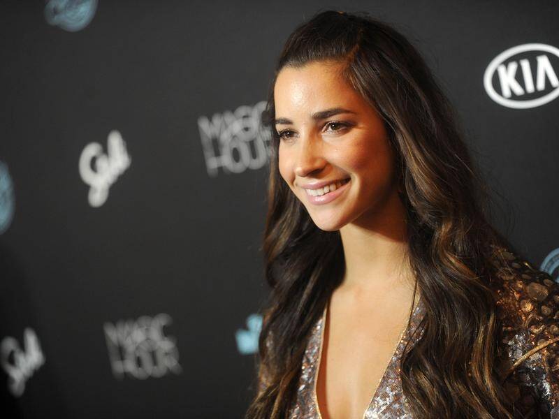 Sex assault advocate and Olympic gymnast Aly Raisman has posed naked for Sports Illustrated.