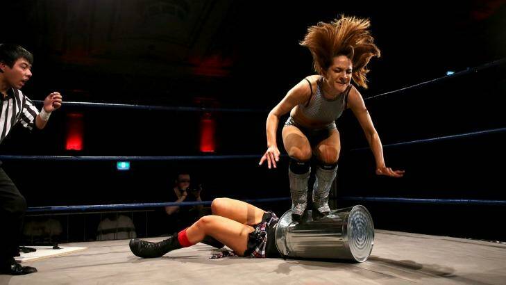 Taking out the trash: Evie stomps on Kellyanne during a Melbourne City Wrestling bout. Photo: Pat Scala